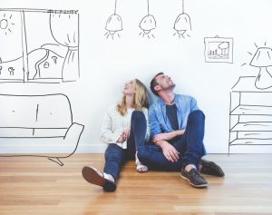 2 people in a house looking up designs -Destination Properties