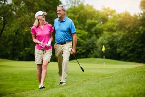 2 People golfing -Destination Properties